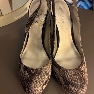 Stylish snakeskin platform heels .